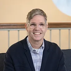 Matt Otto smiling and holding Bible